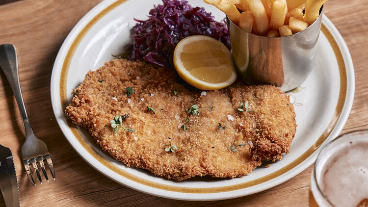 Chicken schnitzel with chips, slaw and a pot of beer. 