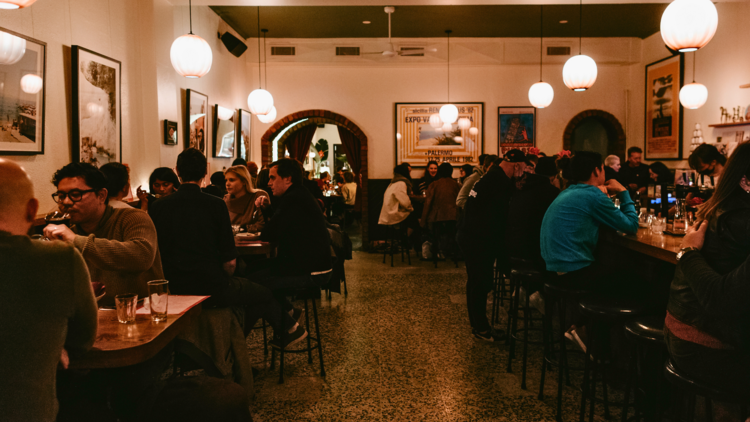 The interior of a crowded Italian restaurant.