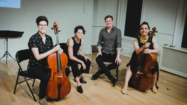 ChamberQUEER founders sit with their instruments.