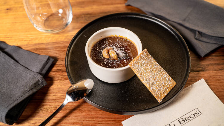 Chai creme brulee dessert with ginger tuile.