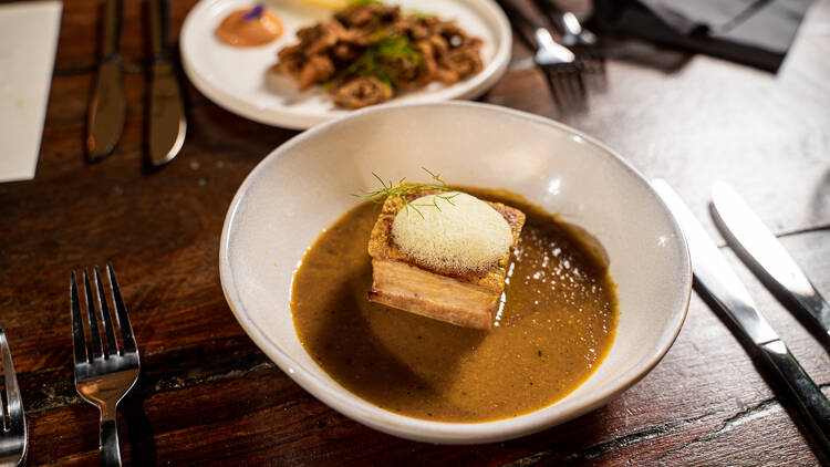 Pork belly curry with foam.