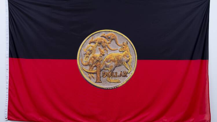 Aboriginal flag with dollar coin as sun