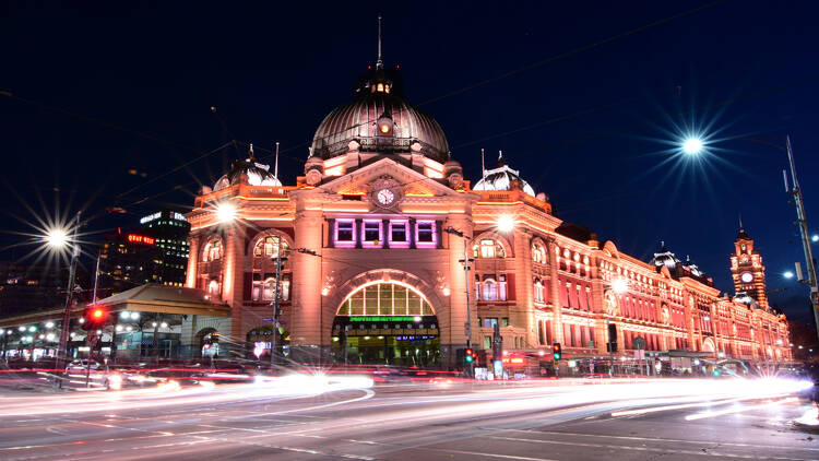Flinders Street Station in Melbourne at night.