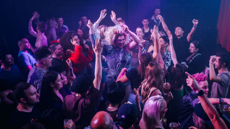 Drag queen dances with revellers at Sanctuary at Universal Superclub