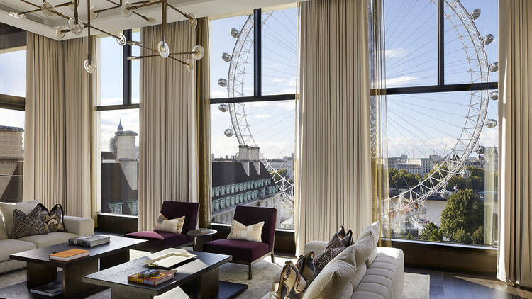 The penthouse living room looking on to the London Eye