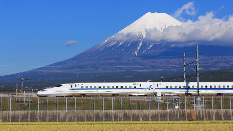 Shinkansen rolling past Mt Fuji in Japan
