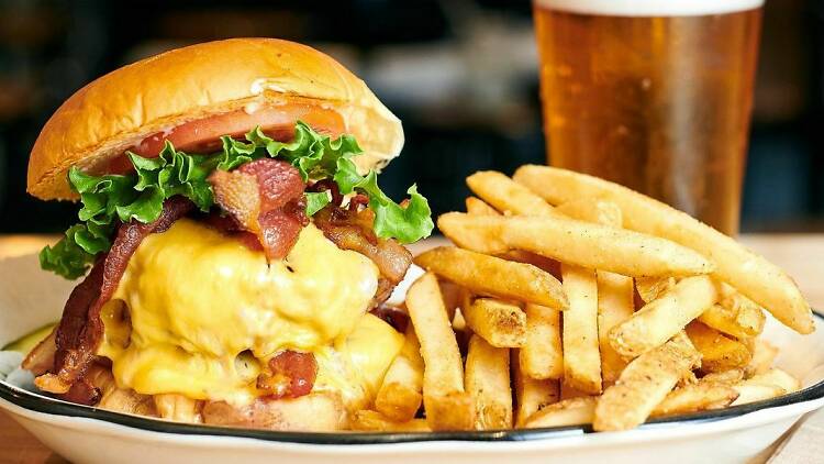 Black Tap burger with fries and a beer