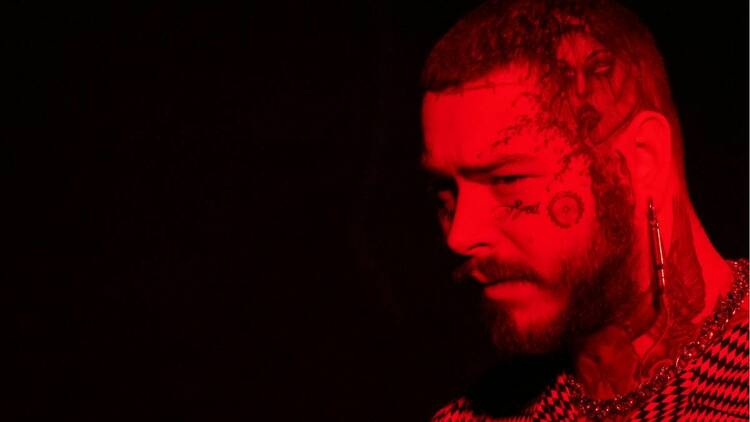 red headshot of the singer post malone