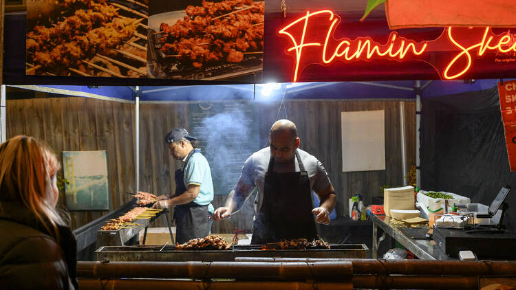 A food stall at an outdoor night market.