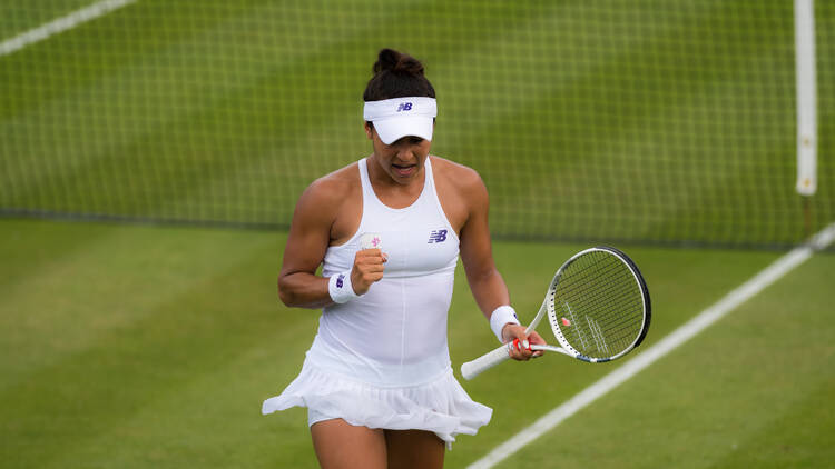 Heather Watson playing tennis in all-white 