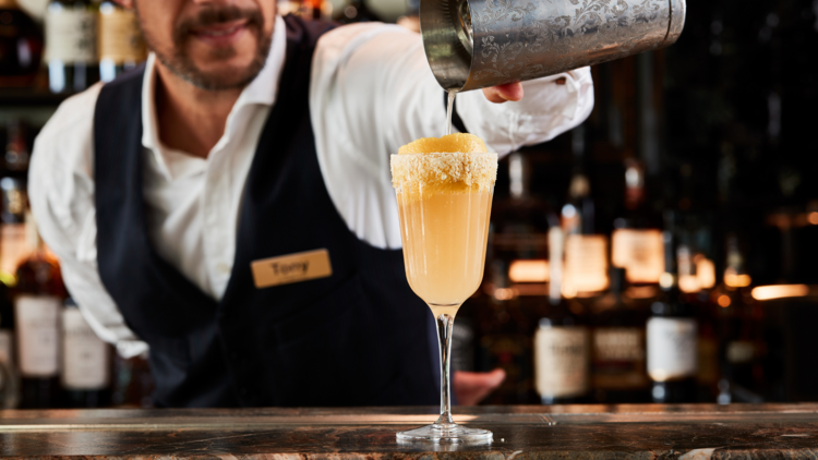 Bartega cocktail being poured at the bar