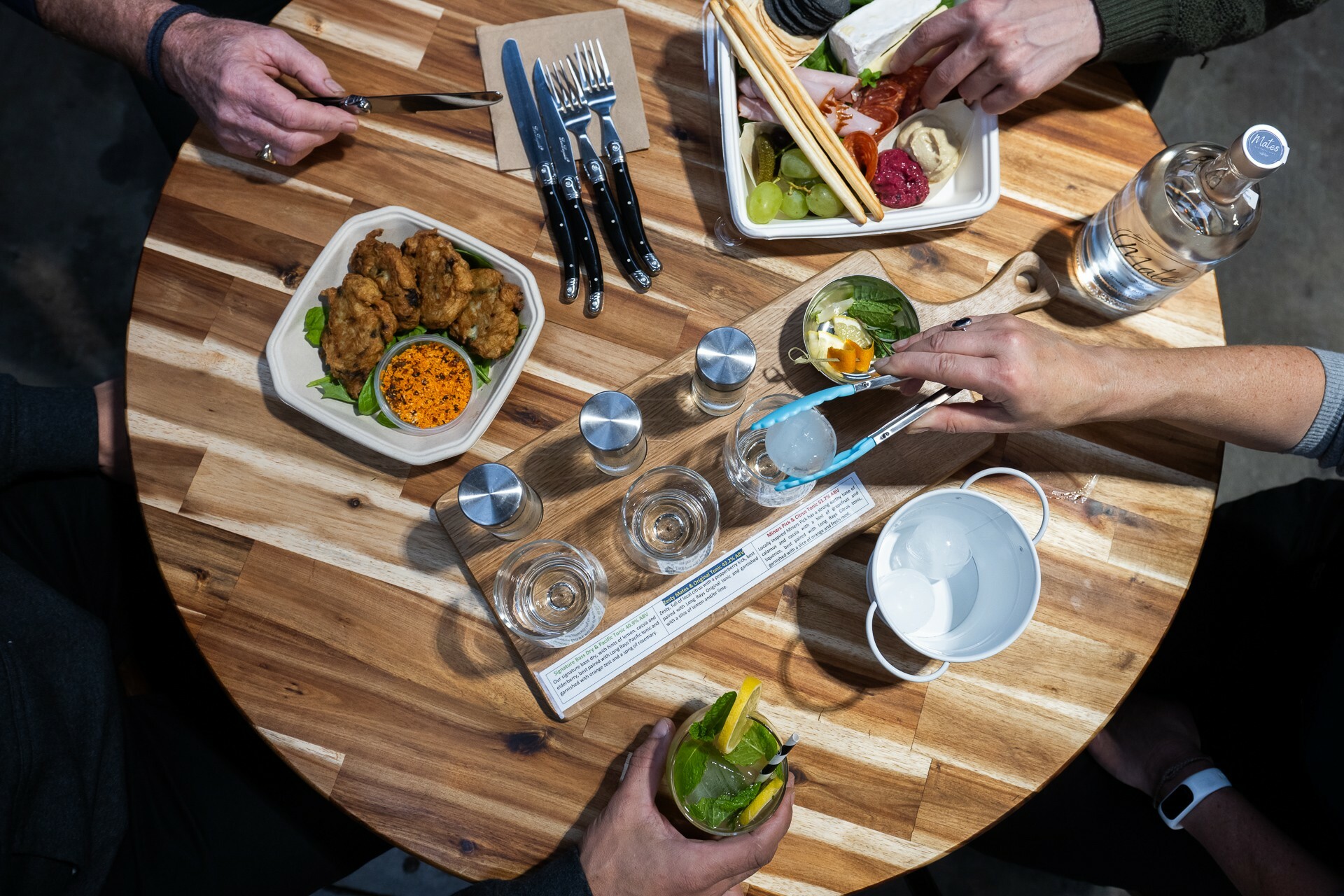 A gin tasting spread with some bar snacks