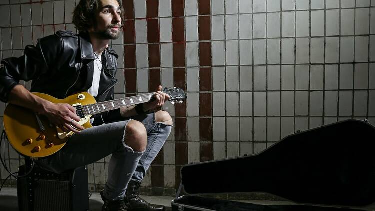 Street musician performing on subway platform