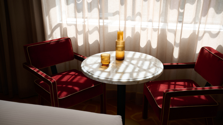 Table and chairs in dappled light