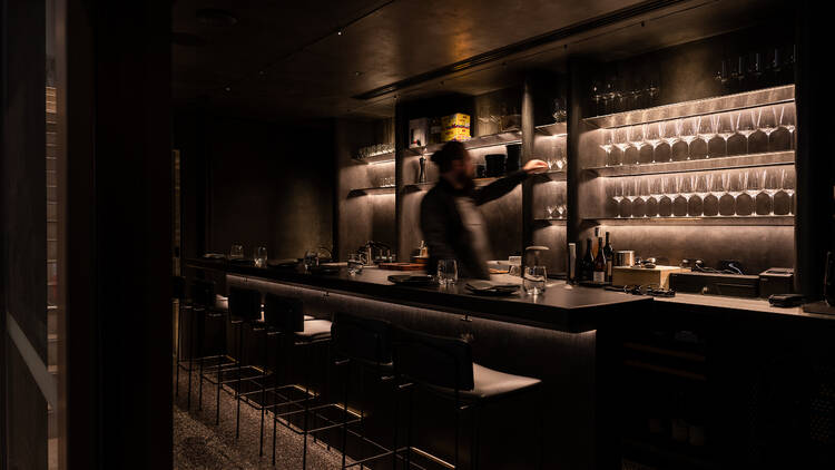 A bartender in motion at La Rue, an eight-seater speakeasy bar.