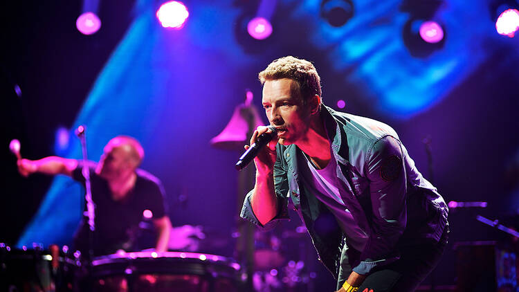 Coldplay performing live on stage