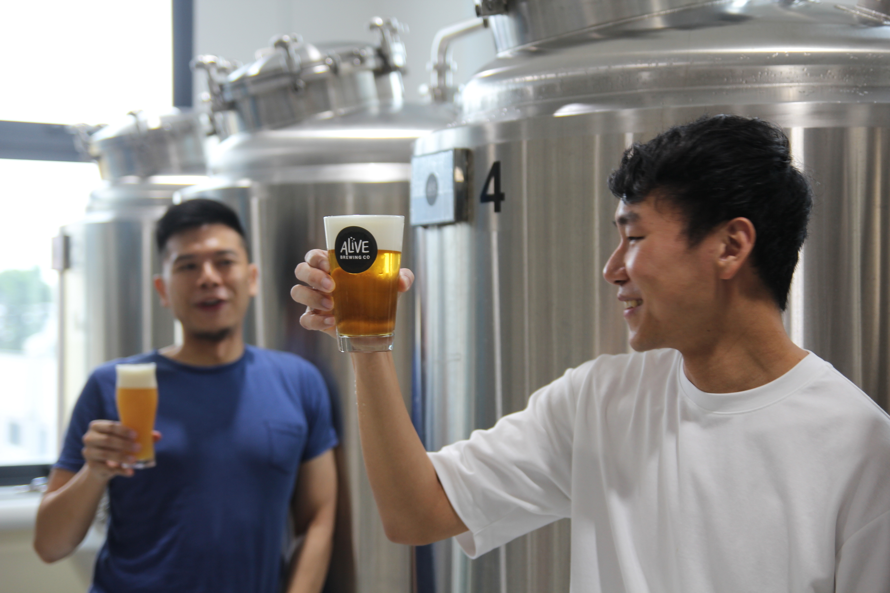 Brewers Ryan & Qing Yang enjoying a toast