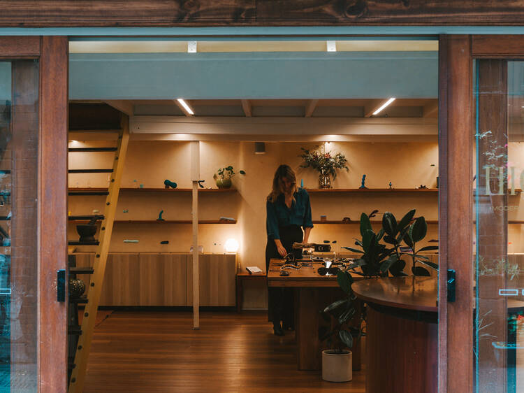 The interior of a store, looking from outside through an open doorway. 