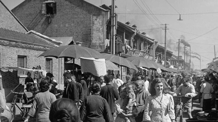 Jewish refugees and their Chinese neighbors at a market in Hongkou