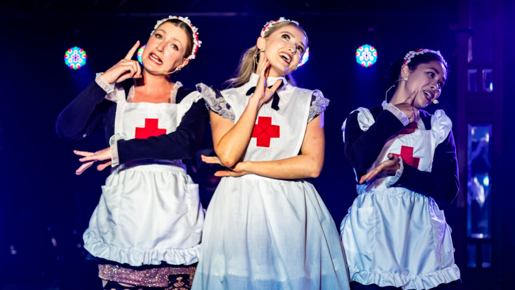 Three nurse actresses in a musical