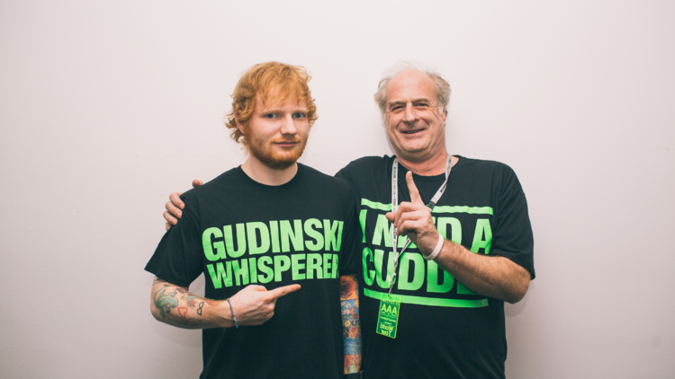 Ed Sheeran and Michael Gudinski posing together.