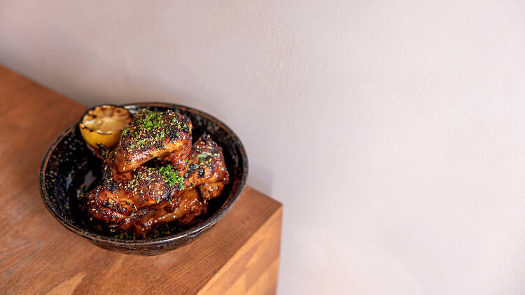 Sherry vinegar glazed chicken wings with charred lemon at Isla 