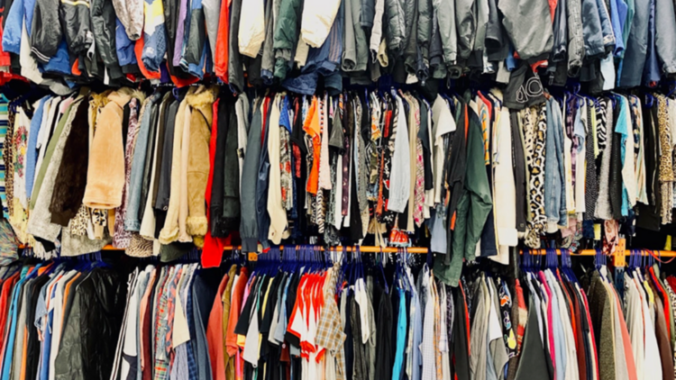 Clothes hung densely on racks