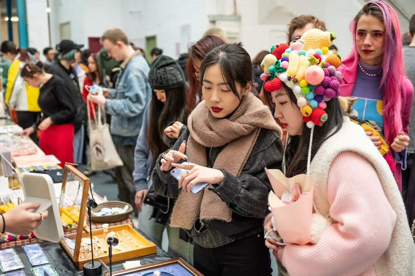 Customers browsing stall at DIY Art Market