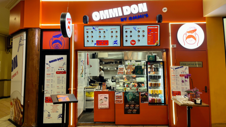 Ommi Don's bright orange storefront