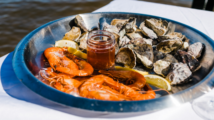 A bowl of prawns and oysters