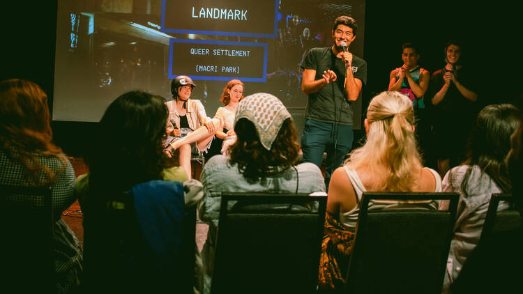 A comedian on stage with a microphone.