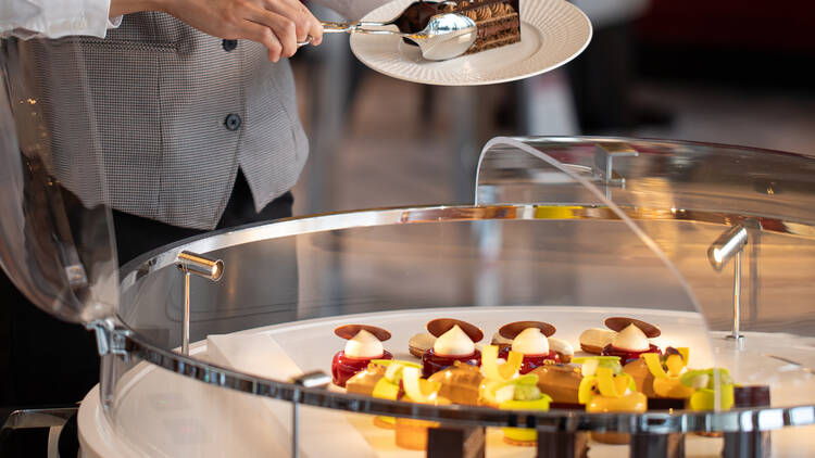 Indulge in afternoon tea at the Raffles Lounge & Terrace