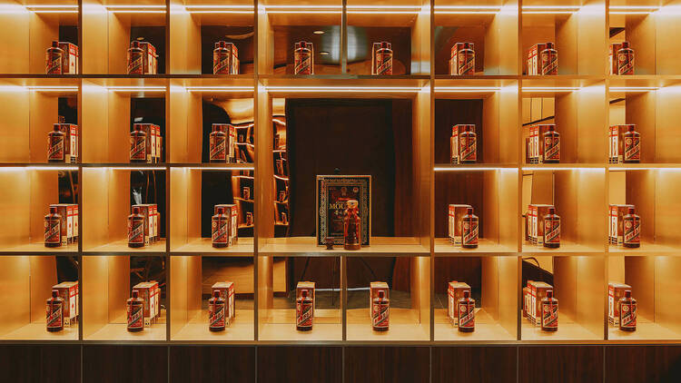 Bottles of Moutai on a grid-like shelf.