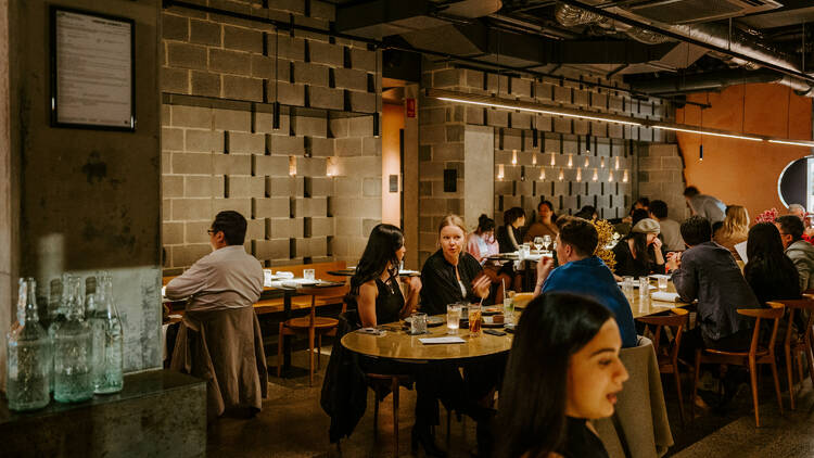 The moodily lit dining space at Yan Melbourne.