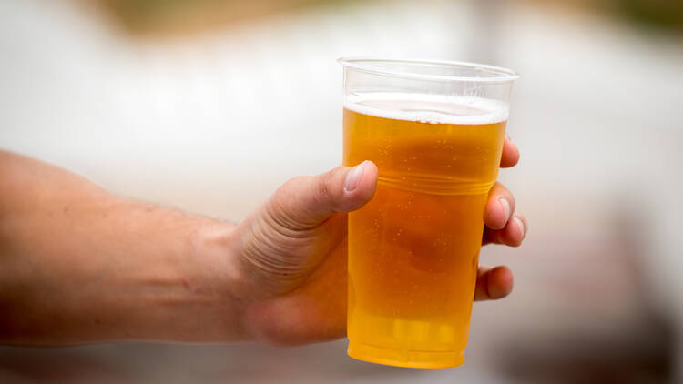 Beer in plastic takeaway cup