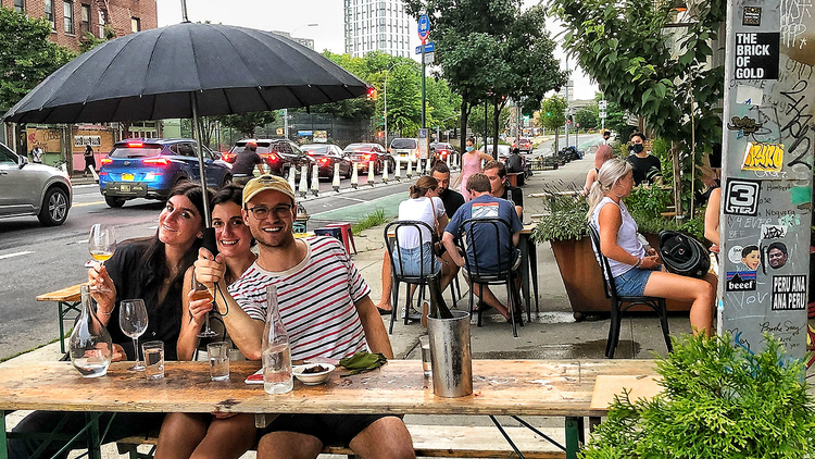 People sitting outside  (Lighthouse Bk )