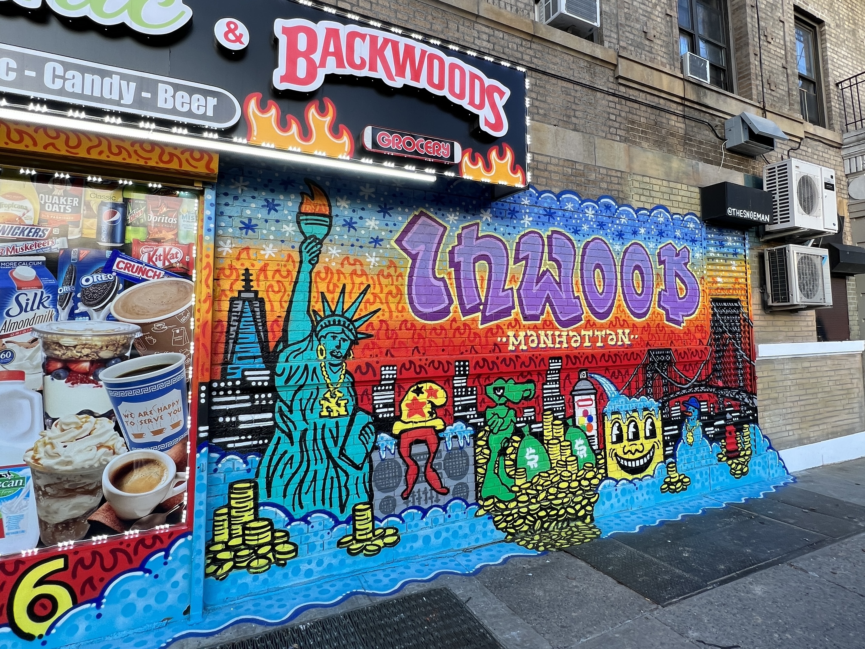 Storefront mural in Inwood