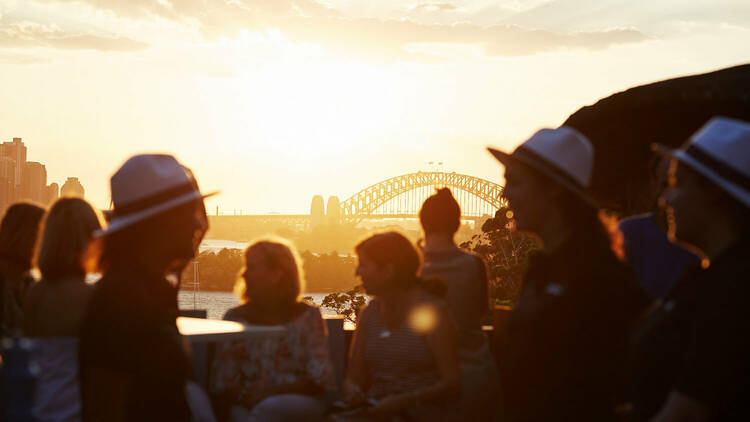 People gathered at Taronga Zoo looking over the harbour 