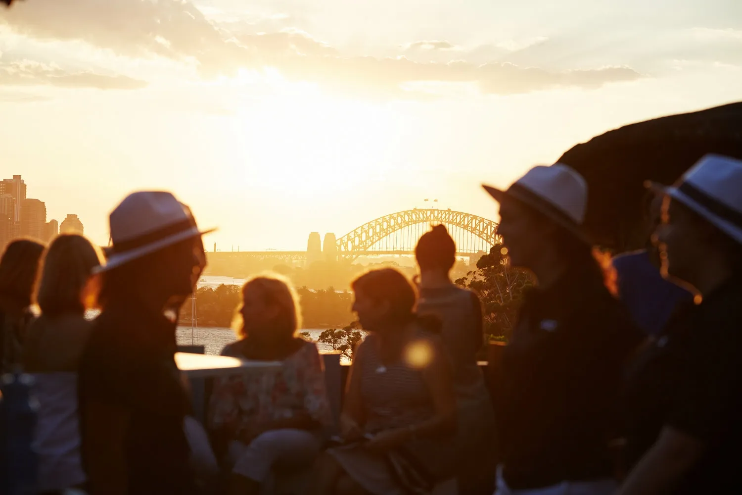 People gathered at Taronga Zoo looking over the harbour