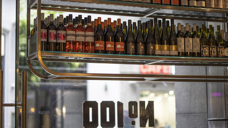 Street view from inside a delicatessen.