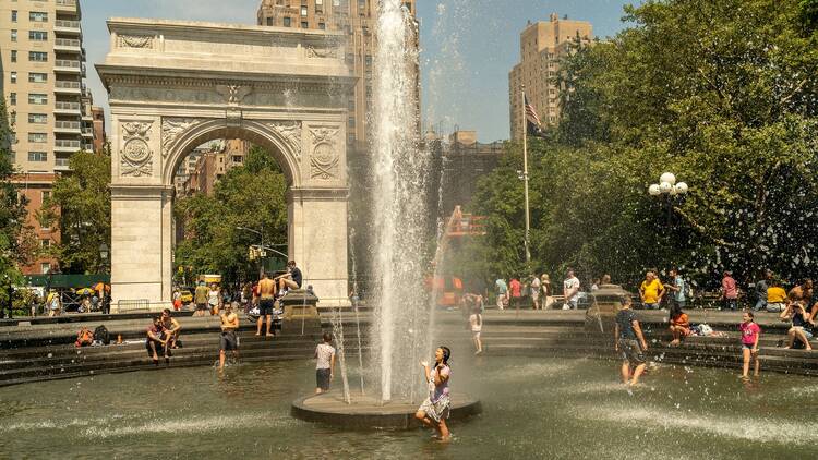 New Yorkers frolic in the fountain at Washington Square Park