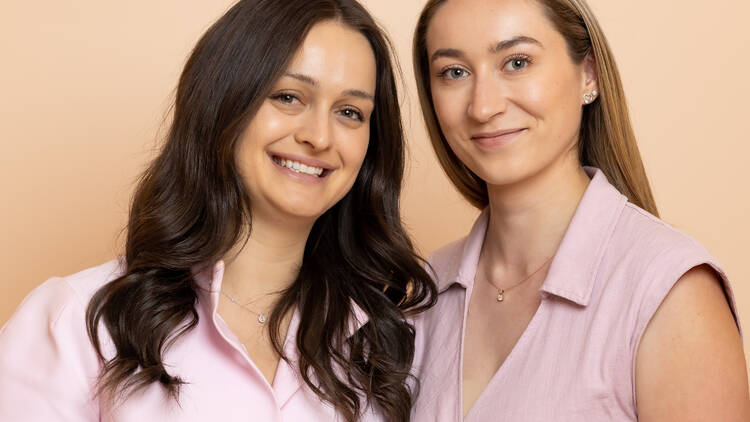 Two women in pink tops