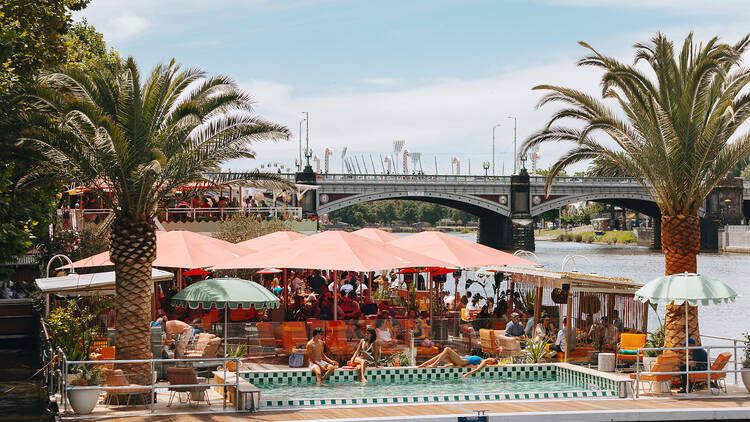 Arbory Afloat decked out with palm trees and a swimming pool.