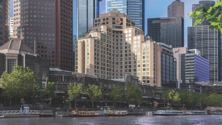 A big hotel overlooking a river