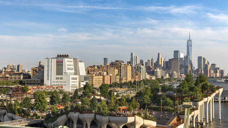 A view of the west side of Manhattan with Little Island in the foreground.