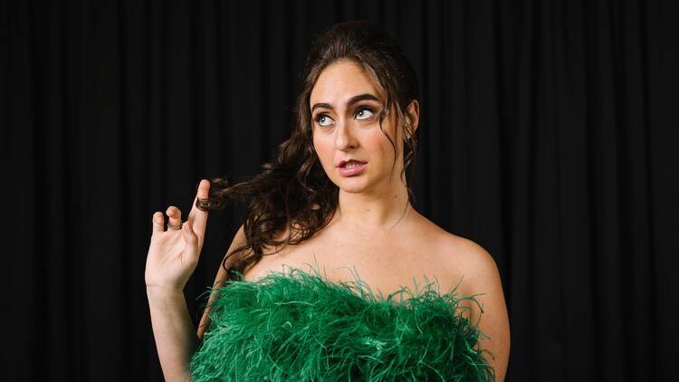 picture of catherine cohen in a green dress