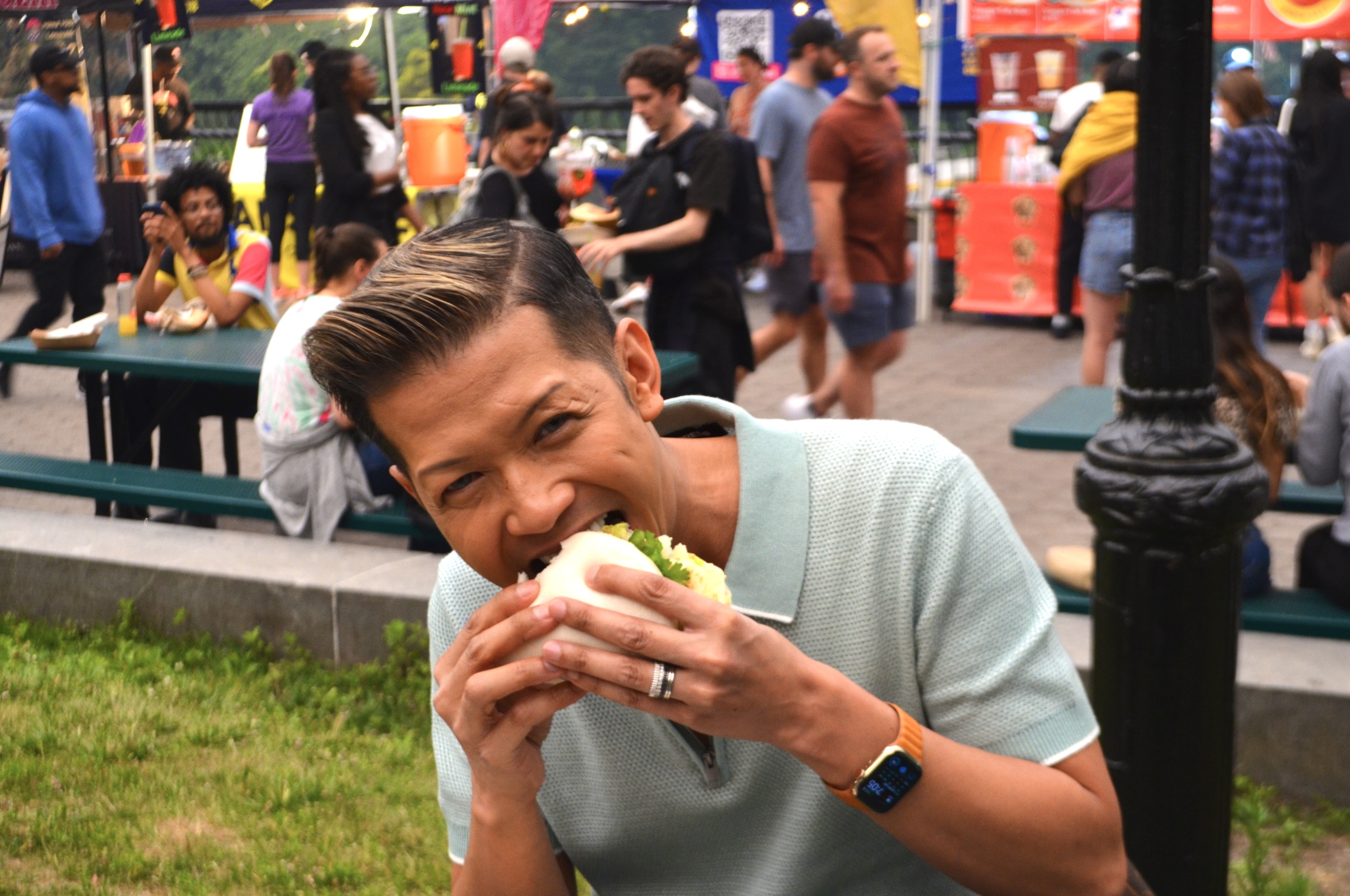 A man eats a sandwich.