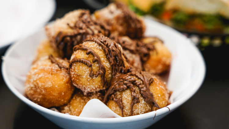 Sicilian doughnut balls with nutella drizzle