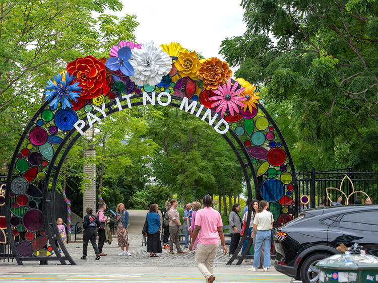 "Pay It No Mind" floral archway in Brooklyn