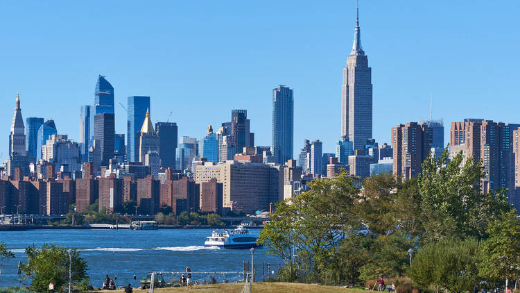 A soccer field in Marsha P. Johnson State Park in Williamsburg, Brooklyn. Behind is the East River and the skyline of Midtown Manhattan. 